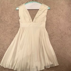 White pleated mini dress